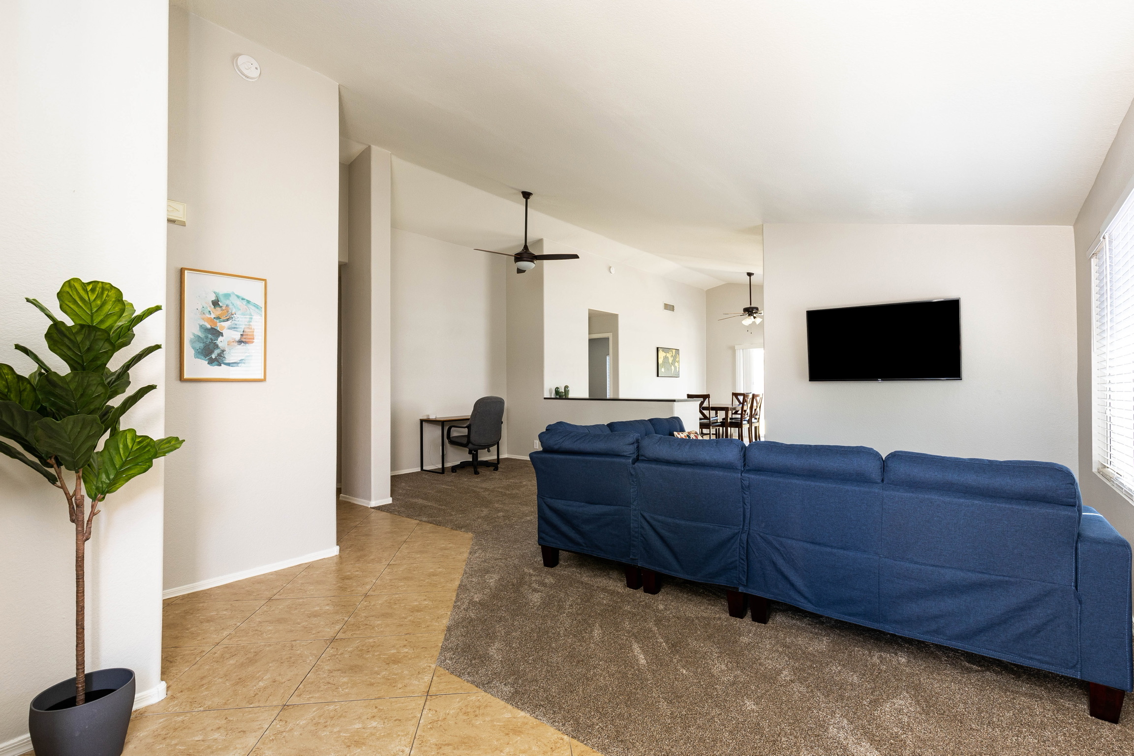 Detroit St house living room with blue sofa